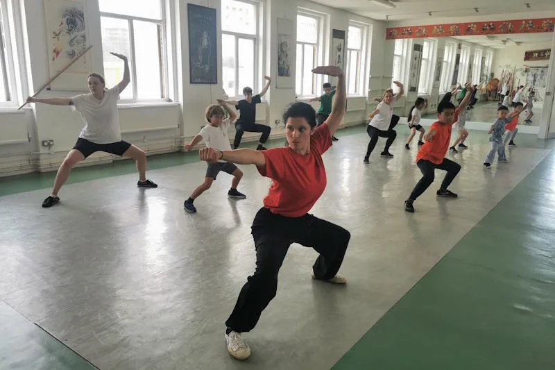 Students practicing Shaolin Kung Fu in a group class setting at the centre
