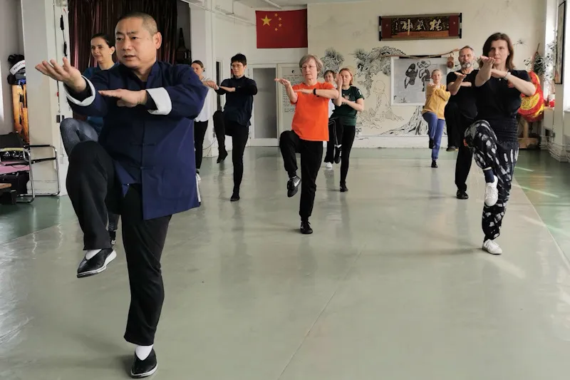 Shifu leading a Tai Chi group class
